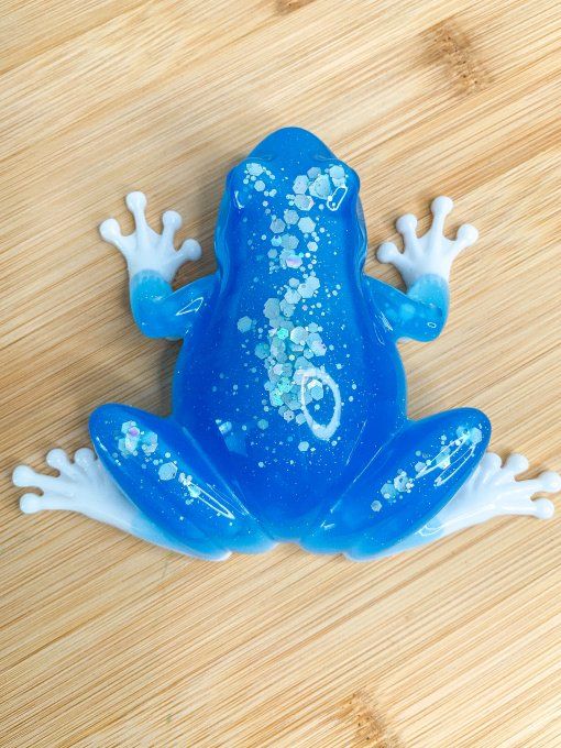 Grenouille fluorescente bleue et blanche avec paillettes