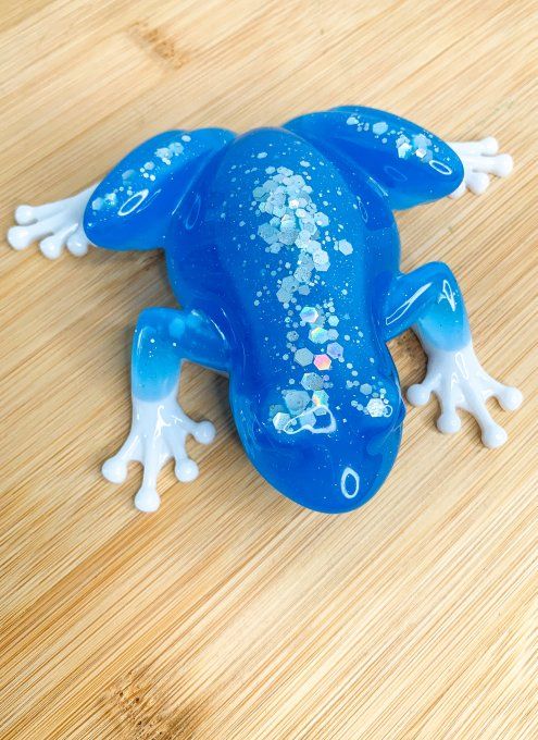 Grenouille fluorescente bleue et blanche avec paillettes